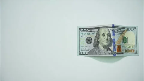 A dollar bill moves on a white background and becomes a euro bill Stock Footage 288096770