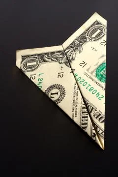 Dollar bill plane Stock Photos