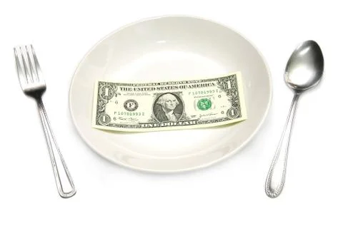 A dollar bill in plate Stock Photos