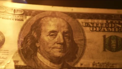 Dollar bill quickly burns up completely in closeup. Dollars in the flames of Stock Footage 158177771