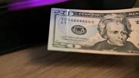 Dollar bill under UV light Stock Footage 10721804