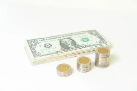 Dollar bills and coins stack isolate on white background. Stock-Fotos