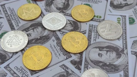 Dollar bills and cryptocurrencies like bitcoin, ethereum, iota, litecoin, rip Stock Footage 209461992