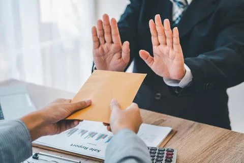 Dollar bills are not accepted as bribes by businesspeople. Concepts of anti-b Stock Photos