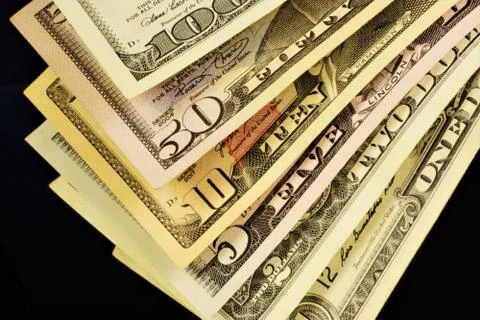 Dollar bills of different denominations. Stock Photos