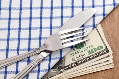 Dollar bills on dining table Stock Photos