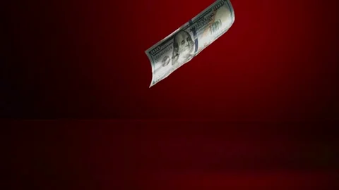 Dollar bills fall and scatter on a red surface Stock Footage 327787430