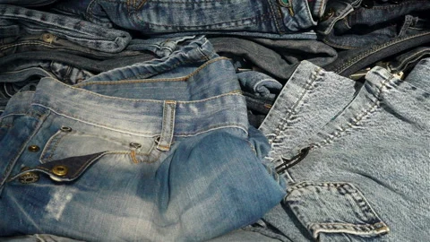 Dollar bills falling on jeans in slow motion. Stock Footage 126623281