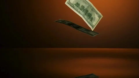 Dollar bills falling on orange reflective surface Stock Footage 327050189