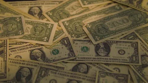 Dollar Bills Falling onto a Table Stock Footage 94159730