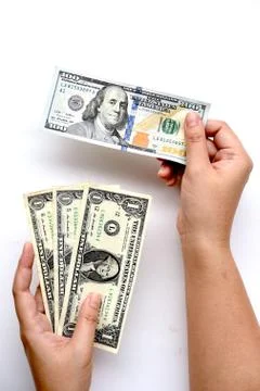 Dollar bills on hand Stock Photos