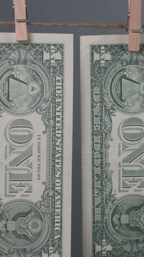 Dollar bills hanging on a clothesline, showcasing their unique detailed designs Stock Footage 288319376