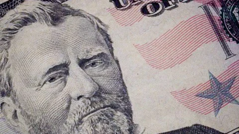 A Dollar bills in mixed denominations attached close up motion graphic Stock Footage 155304741