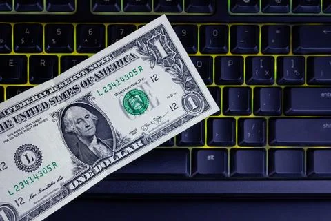 Dollar on a black keyboard Stock Photos
