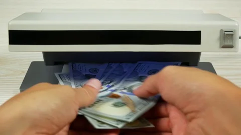Dollar check in the currency detector. Video stock 79034958