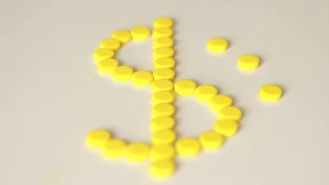 Dollar mark made with yellow pills 動画素材 79589987