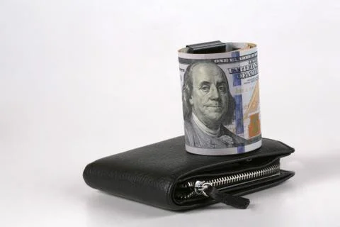The dollar, a model on a dollar bill, a concept and idea of the cost of time Stock Photos