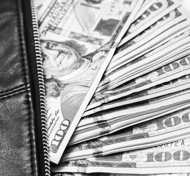 Dollar notes in a wallet, hundred-dollar bills are in a bag, Stock Photos