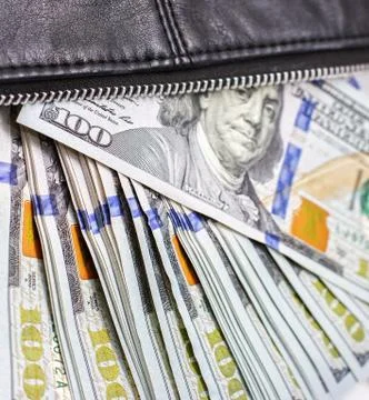 Dollar notes in a wallet, hundred-dollar bills are in a bag, Stock Photos