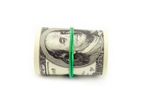 Dollar roll tightened with band. Stock Photos