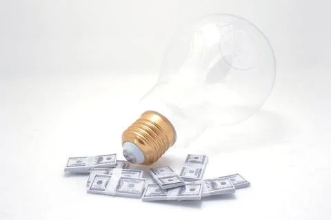 A Dollar Stack Light bulb Conceptual, Finance And Banking Stock Photos