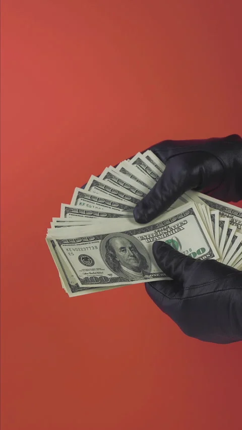 Dollar Touch with black leather gloves on red background Video stock 268851617