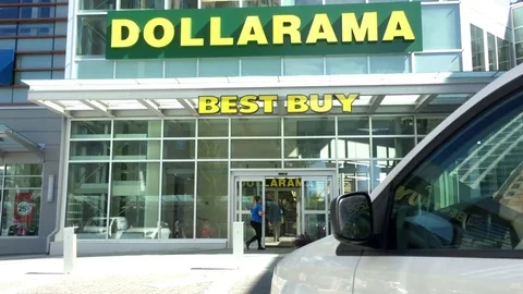 Dollarama store front with people going to store entrance with 4k resolution. Video stock 79092781