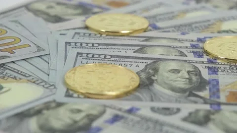Dollars and bitcoins, Many Dollars and Bitcoins spinning on turntable, timelipse Stock Footage 159070429