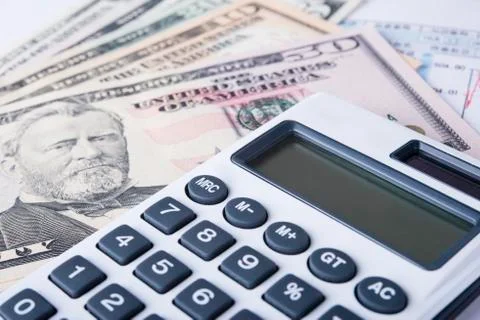 Dollars and Calculator Stock Photos