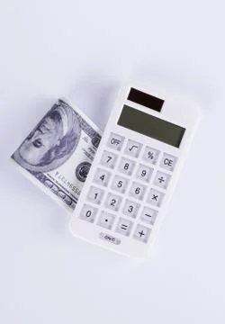 Dollars and Calculator Stock Photos