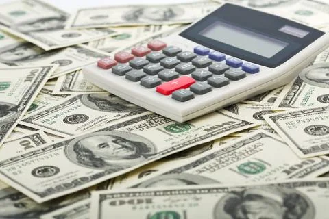 Dollars and calculator with plus red button Stock Photos