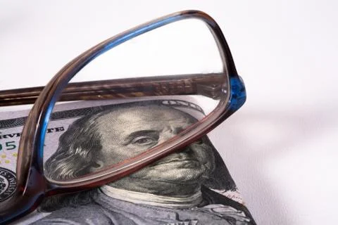 Dollars and glasses Stock Photos