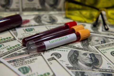 Dollars and negative test at coronavirus. Stock Photos