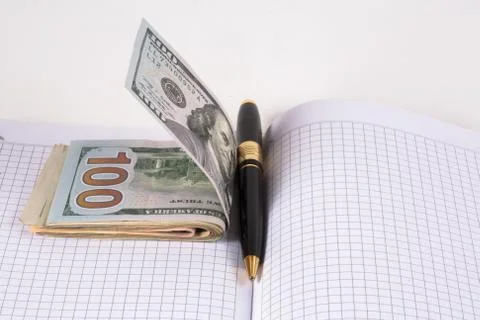 Dollars and pen, notebook Stock Photos