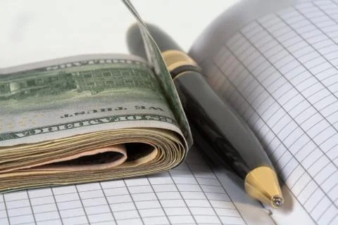 Dollars and pen, notebook Stock Photos