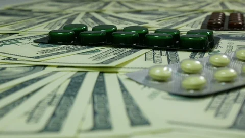 Dollars and tablets Stock Footage 88408639