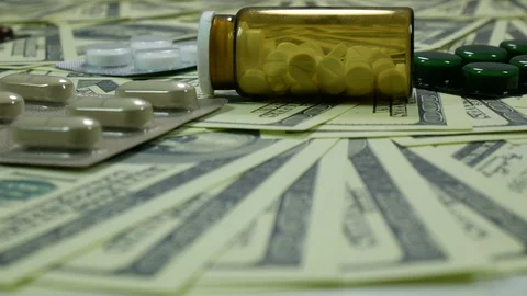 Dollars and tablets on the table Stock Footage 88408622