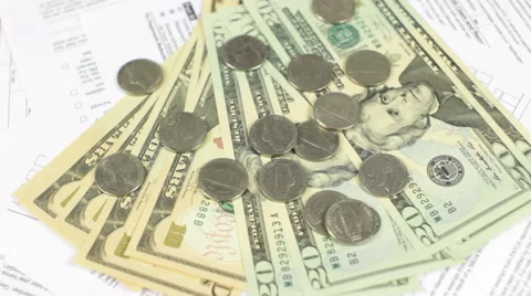 Dollars and Tax Forms Rotating  Stock Footage 61025517