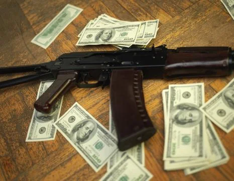 Dollars and weapon 写真素材