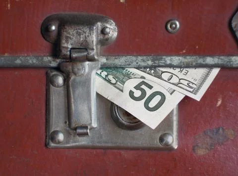 Dollars bills within old case Foto stock