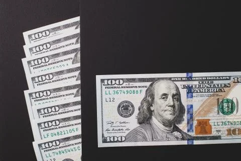 Dollars on a black background, close-up. Fotos Stock
