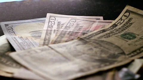 Dollars on black background Stock Footage 70499434