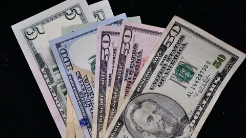 Dollars on black background Stock Footage 70501558