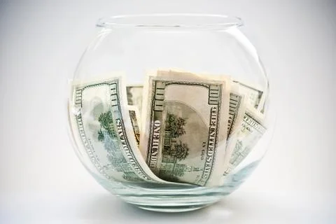 Dollars in a bottle Stock Photos