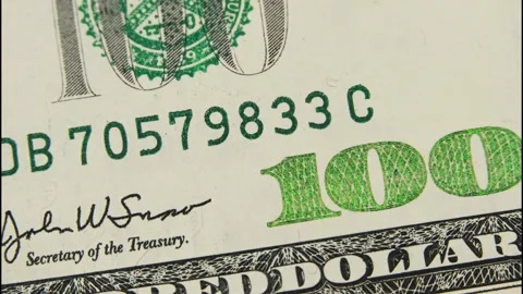 Dollars in cash stop movement. The background is a US fiat money sign. Stock Footage 150758752