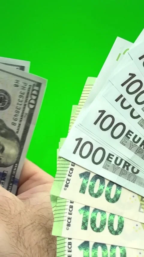 Dollars to change to euros Several bills on one hundred dollar on feminine hand Stock Footage 244480429
