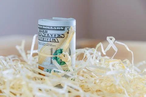 Dollars close up. Banknotes rolled into a roll with a rope. American currency Stock Photos