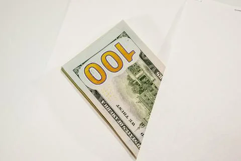 Dollars in a conwind on white background, a lot of money in an envelope. 스톡 사진
