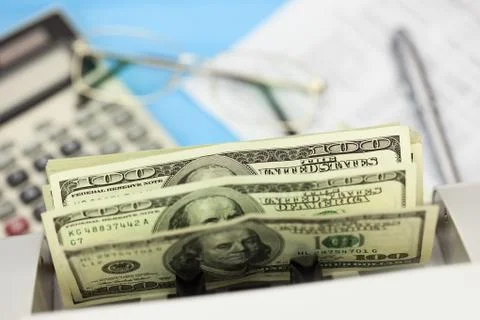 Dollars in the counting machine on business  background Stock Photos