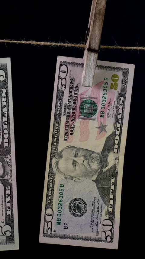 Dollars dry on a clothespin rope Stock Footage 307854013